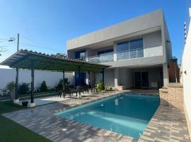 Villa Matthew - Villa de Lujo con Piscina Privada y BBQ, Cerca al Mar，位于Juan de Acosta的酒店