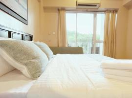 Nade Suites - Pico De Loro MIA 609，位于纳苏格布的公寓式酒店
