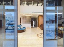 نخيل هجر للشقق الفندقية Nakheel Hajr Hotel Apartments，位于胡富夫的带停车场的酒店