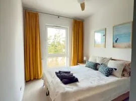 Apartament Diuna z dostępem do basenu, siłowni, hali sportowej, sauny