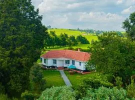 The Farmhouse, Tigoni, 1920s home, 85 acre tea farm, outdoor bath & shower