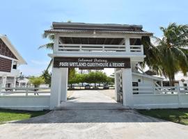 Capital O 90520 Fikri Wetland Guesthouse And Resort，位于佩纳利克村的酒店