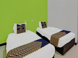 SPOT ON 92255 Lucky Guesthouse，位于Kubang的酒店