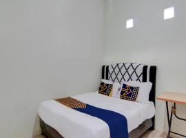 SPOT ON 92797 Awi Stay Syariah Near SIMPANG KAWASAN INDUSTRI WILMAR PELINTUNG