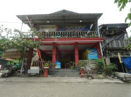 OYO 93628 Scorpion Guest House & Beach，位于图隆阿贡的酒店