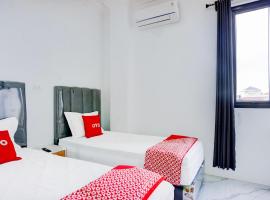 Capital O 94254 Dental Inn，位于班达亚齐的酒店