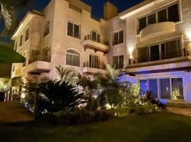 One Sixteen Guest House，位于Sheikh Zayed的酒店