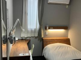 一关阿托商务酒店，位于一关的酒店