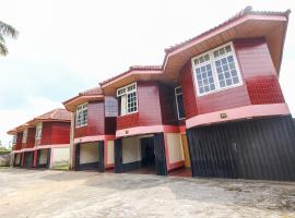 OYO 3180 Hotel Rian Cottage，位于巨港的酒店