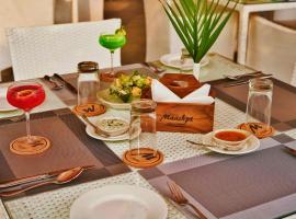 Maashpi Hotel & Resort, Candolim，位于坎多林的酒店