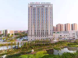 泰州医药城瑞贝庭公寓酒店，位于Sixiang的酒店