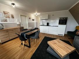 Haus-Fehmarn-am-Dorfteich-|-Wohnung-1-Sued，位于费马恩的海滩酒店