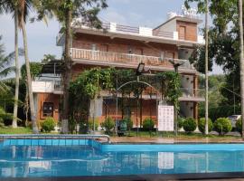 DOLPHIN ENCLAVE SERVICE STUDIO APARTMENTS，位于卡尔佩特塔的酒店