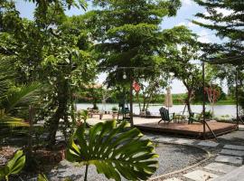 Cắm trại trong ngày view sông - Homestay Mẹ Khang 2，位于Cu Chi的酒店