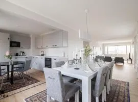 Renovated 3BR apartment with balcony just 350m from train station and 500m from Nokia Arena