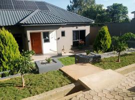 Warm Care Executive Apartments，位于Mpemba的酒店