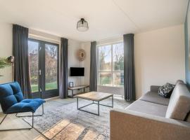 Zeer comfortabel vakantiehuis op kleinschalig park 6 personen，位于Ewijk的酒店