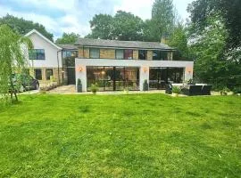 Lovely large modern home in private wooded estate