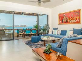 Luxury condo with ocean view & beach access，位于塔果鲁达的分契式公寓