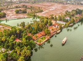 Alaya Stays Palm Dale Heritage Backwater Retreat with Garden & Restaurant，位于阿勒皮的酒店