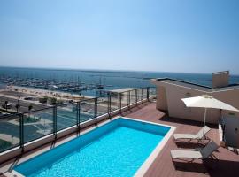 瑞尔玛丽娜滨海酒店，位于奥良的酒店
