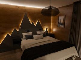 Appartement ambiance chalet avec vidéo-projecteur，位于莫雷兹的酒店