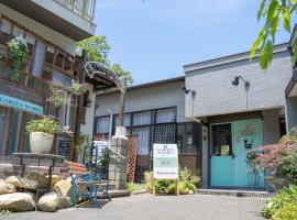 ゲストハウスＡ＆C，位于龟冈的酒店