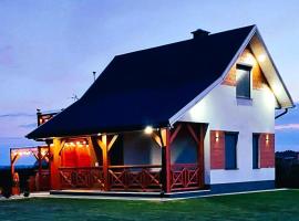 Domek NIVA z Jacuzzi i Widokiem na Zalew，位于Nawóz的酒店