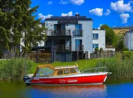 4jeziora - prywatny dostęp do rzeki, pomost, ogrodem, wiata grillowa, rowerek wodny, kajaki w cenie, parking, psiaki dozwolone