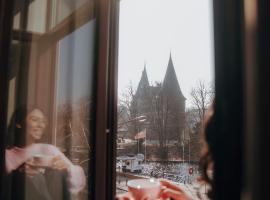 荷尔斯登托菲林沃尔姆艮酒店，位于吕贝克的酒店