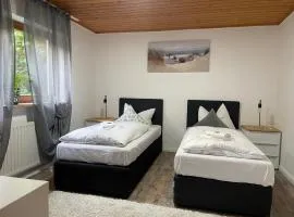 Appartio - Gästehaus "Dorfblick" - komfortable Ferienwohnungen mit Küche und Waschmaschine