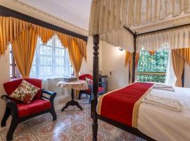 Palm Grove Cottages - Leisure Resort，位于比纳里姆的酒店