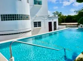Renovated TRANQUIL Sea View Studio with Balcony, Infinity POOL, Overwater Deck & Kitchenette, 2nd Floor