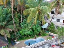 Pension Les Palmiers，位于Kipé的酒店