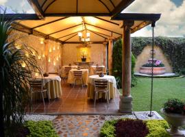 Hostal Villa Toscana，位于拉奥罗拉国际机场 - GUA附近的酒店