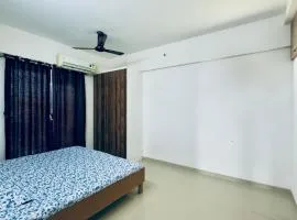 New Spacious 2BHK apartments in Tirupati Near Railway Station with fully equipped kitchen, AC bedrooms, Washing Machine, 24 hours water, caretaker service, and ample space for car parking & ideal for families and pilgrims