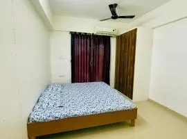 New Spacious 2BHK apartments in Tirupati Near Railway Station with fully equipped kitchen, AC bedrooms, Washing Machine, 24 hours water, caretaker service, and ample space for car parking & ideal for families and pilgrims