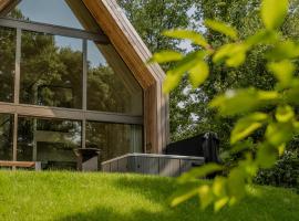 Lodge met Jacuzzi - 4 personen - Woodz Lodges，位于赫斯登-佐尔德尔的酒店