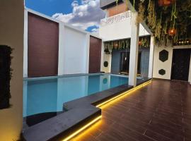 Suna'a home Logpom，位于杜阿拉的带泳池的酒店