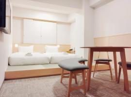 Apartment Hotel DIG the OSAKA，位于吹田的酒店