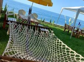 Seafront Apartment by the sea and with a beach and with big garden