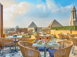 Cleo Patra Pyramids Tower Inn，位于Banī Ghālib的带停车场的酒店