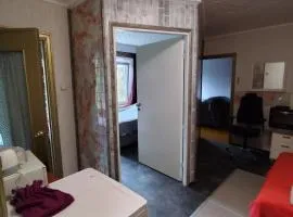 your room in a three-room apartment with a shared kitchen, bathroom, and toilet