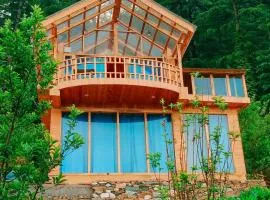 Glass House by Himalayan Cedar Nest