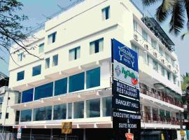 Hotel Golden Couch，位于Badagara的酒店