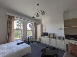 Ensuite triple room by Swansea University Hospital v