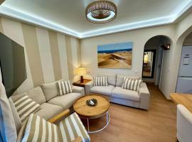 Bungalow tranquilo en Maspalomas，位于英格兰海滩的酒店