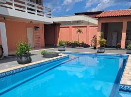 Casa Rosa Su&iacute;tes 5 min de caminhada da PRAIA DA PONTA NGRA，位于马瑙斯的海滩酒店