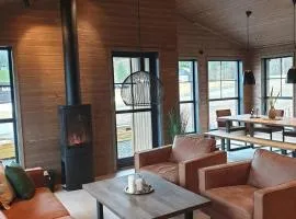 2 cabins surrounded by beautiful nature