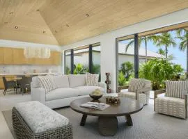Palm- and pond-filled courtyard with ocean views villa